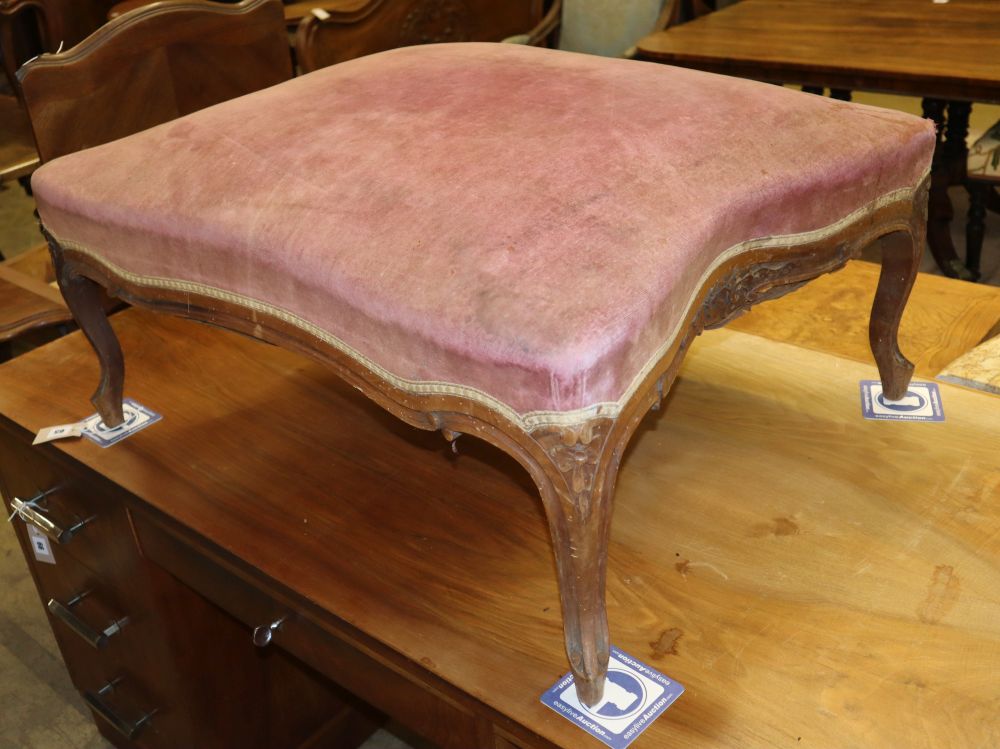 A large 19th century French mahogany upholstered stool, W.85cm, D.68cm, H.35cm